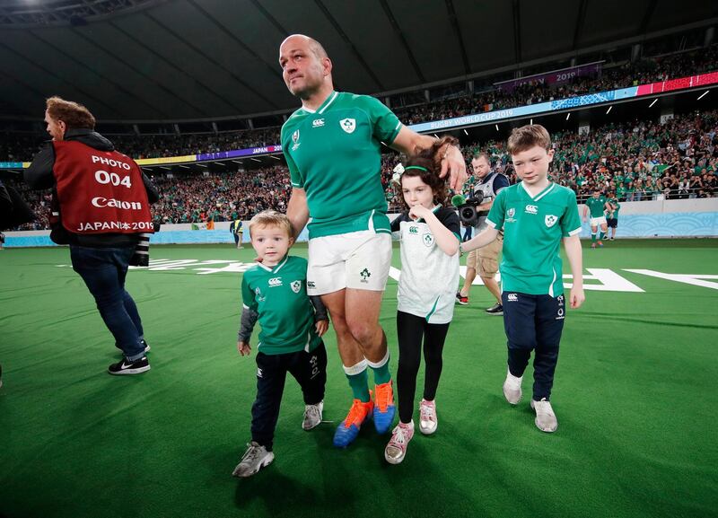 Ireland's Rory Best leaves the pitch with children after the match, Tokyo Stadium, Tokyo, Japan. REUTERS