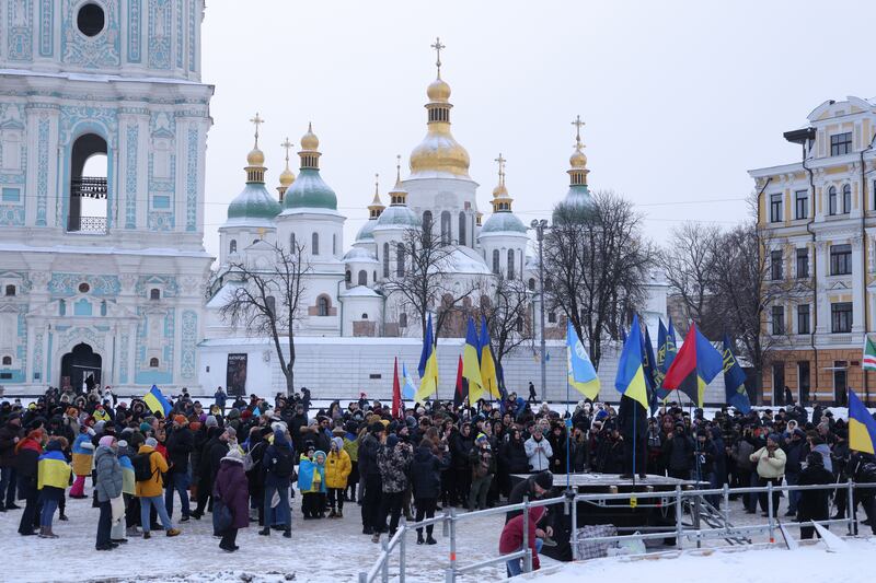 People attend a patriotic rally at Sophia Square on Unity Day, held on January 22, in Kiev, Ukraine. Getty