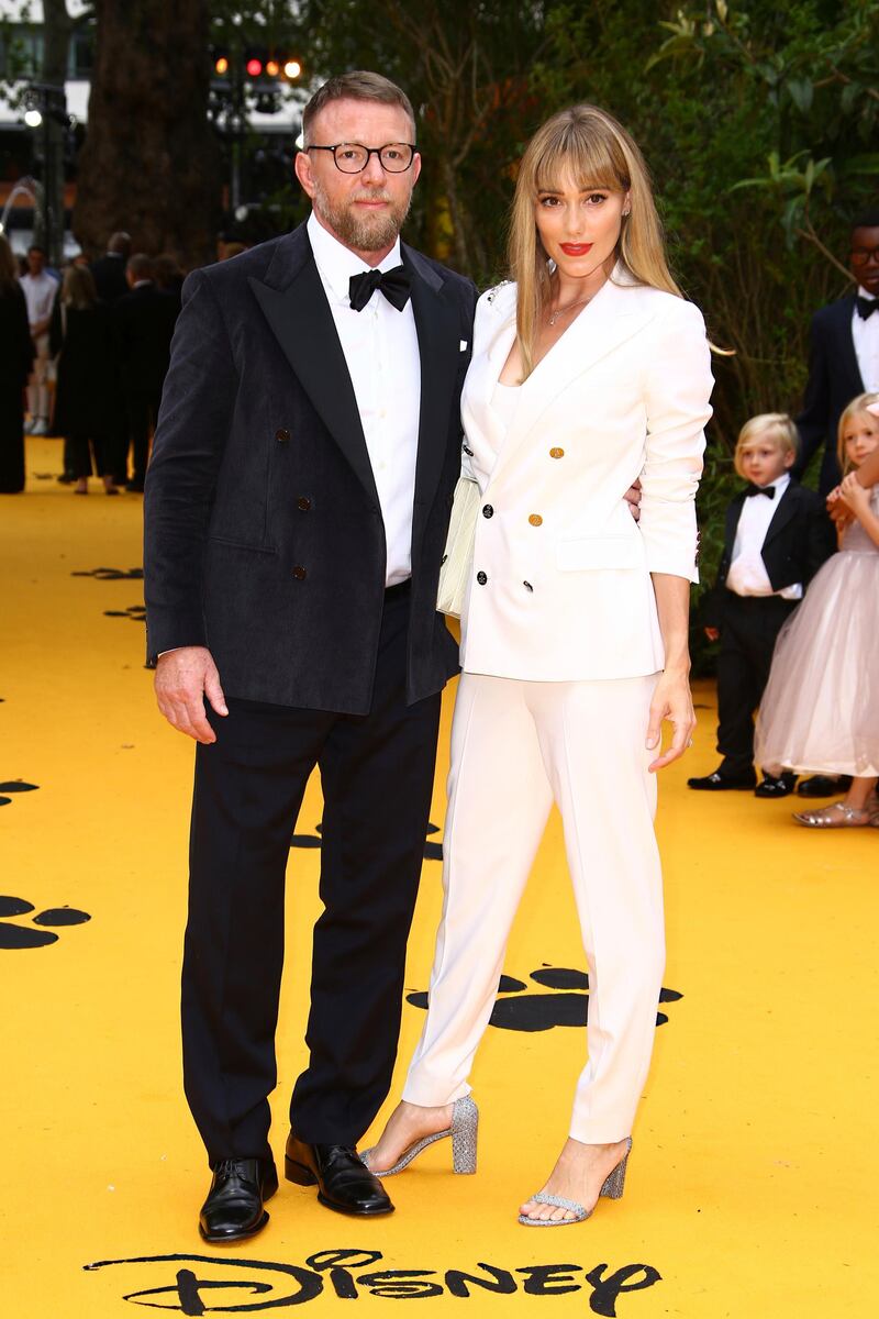 Guy Ritchie, left, and Jacqui Ainsley attend the premiere of Disney's 'The Lion King' in London's Leicester Square on July 14, 2019. AP