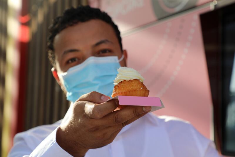 Kais Touihri, marketing manager of the Cupcake ATM, with a coconut cupcake.