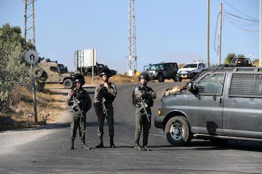 Israeli border policemen stand guard near the scene where the Israeli military said an Israeli soldier was found stabbed to death near a Jewish settlement outside the Palestinian city of Hebron in the Israeli-occupied West Bank August 8, 2019. Reuters