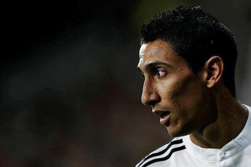 Real Madrid's Angel Di Maria from Argentina reacts during a Spanish Super Cup soccer match against Atletico Madrid at Santiago Bernabeu stadium in Madrid, Spain, Tuesday, Aug. 19, 2014 . (AP Photo/Daniel Ochoa de Olza)