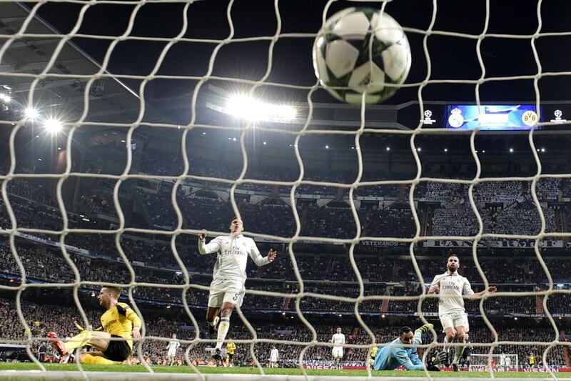 Real Madrid's goalkeeper Keylor Navas, in blue, looks on as Dortmund's Marco Reus' goal hits the net. Javier Soriano / AFP