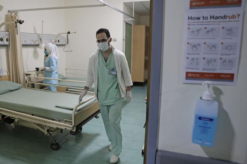 Lebanese nurses wearing protective masks work at a ward where the first case of  coronavirus in the country is being treated, at the Rafik Hariri University Hospital in the southern outskirts of the capital Beirut.  AFP