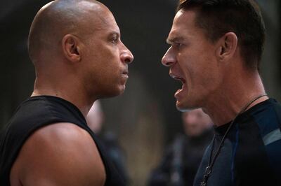 This image released by Universal Pictures shows Vin Diesel, left, and John Cena in a scene from "F9." (Giles Keyte/Universal Pictures via AP)