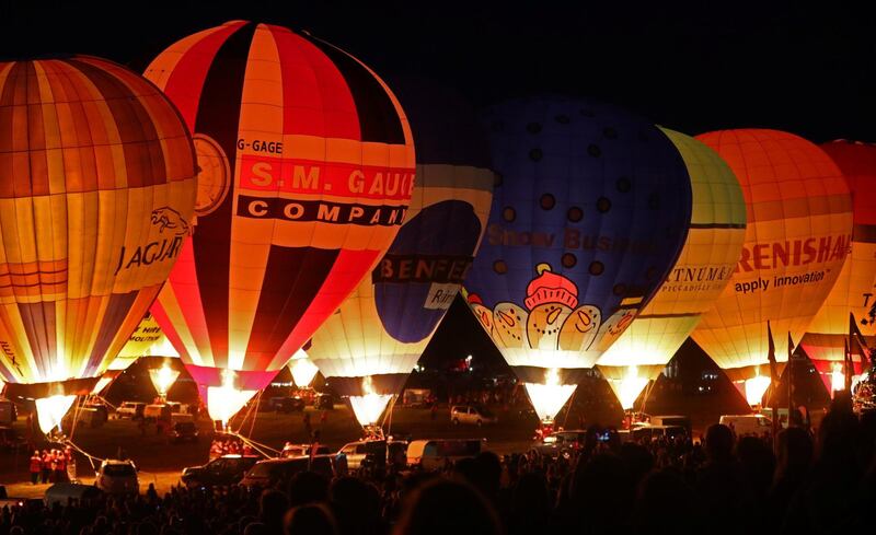 Balloons are illuminated by their burners during the 'Night Glow' display. Getty Images