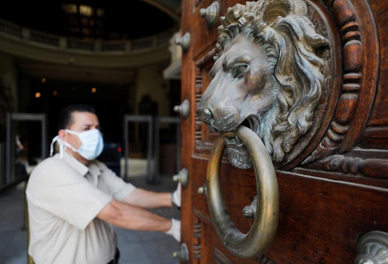 A worker opens doors of the Egyptian Museum at Tahrir Square after its reopening in Cairo, Egypt, on July 1. Reuters