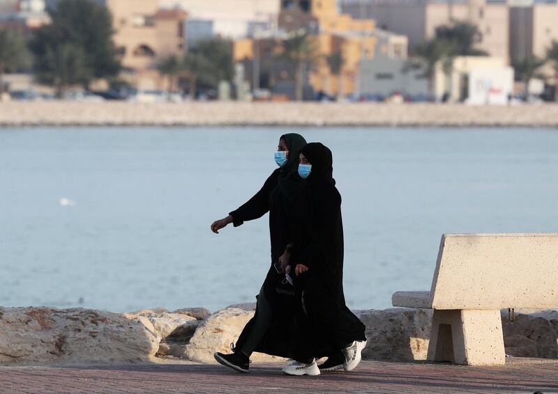 FILE PHOTO: Women wear protective face masks, as they walk, after Saudi Arabia imposed a temporary lockdown on the province of Qatif, following the spread of coronavirus, in Qatif, Saudi Arabia March 10, 2020. REUTERS/Stringer/File Photo