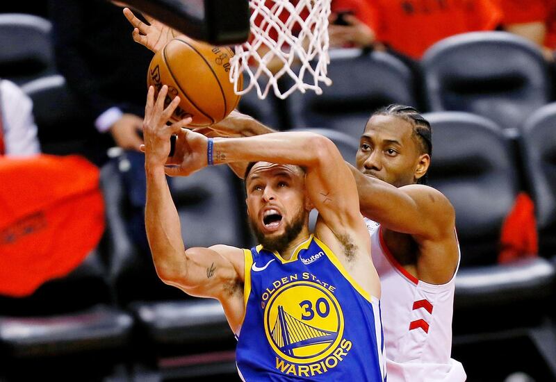 Golden State Warriors guard Stephen Curry (30) shoots while defended by Toronto Raptors forward Kawhi Leonard during the third quarter in Game 5 of the 2019 NBA Finals at Scotiabank Arena, Toronto, Canada. USA Today