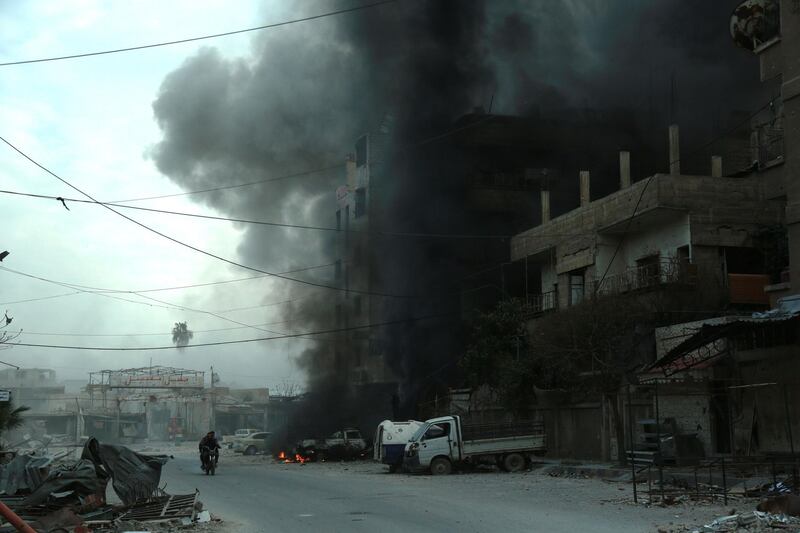 Heavy smoke billows following Syrian government bombardment in the town of Douma in the rebel-held enclave of Eastern Ghouta on the eastern outskirts of the capital Damascus on March 10, 2018. Hamza Al-Ajweh / AFP