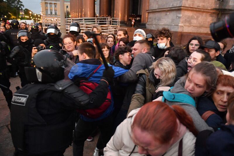 Police officers detain demonstrators in Saint Petersburg. AFP