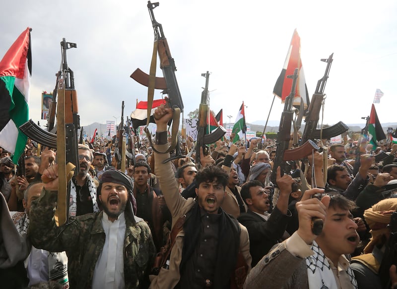 Houthi supporters chant slogans while holding up weapons during a protest against the US and Israel and in support of Palestinians, in Sana'a, Yemen, 08 March 2024. EPA
