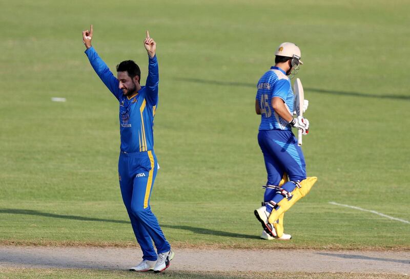 Sharjah, United Arab Emirates - October 17, 2018: Rahmat Shah of the Nangarhar Leopards takes the wicket of Darwish Rasooli of the Balkh Legends during the game between Balkh Legends and Nangarhar Leopards in the Afghanistan Premier League. Wednesday, October 17th, 2018 at Sharjah Cricket Stadium, Sharjah. Chris Whiteoak / The National