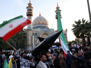 FILE PHOTO: Iranians carry a model of a missile during a celebration following the IRGC attack on Israel, in Tehran, Iran, April 15, 2024.  Majid Asgaripour / WANA (West Asia News Agency) via REUTERS ATTENTION EDITORS - THIS IMAGE HAS BEEN SUPPLIED BY A THIRD PARTY / File Photo