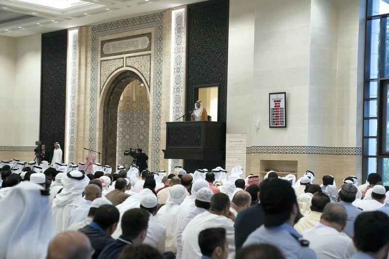 ABU DHABI, UNITED ARAB EMIRATES -June 04, 2019: HE Dr Mohamed Matar Salem bin Abid Al Kaabi, Chairman of the UAE General Authority of Islamic Affairs and Endowments (on platform), Imam at the Sultan bin Zayed The First mosque, delivers a sermon during Eid Al Fitr prayers.

( Hamad Al Mansouri / Ministry of Presidential Affairs )
---