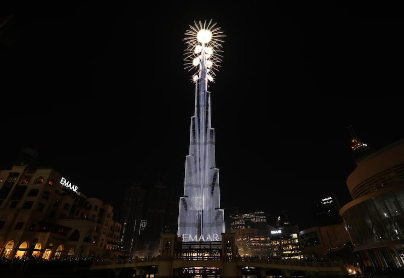 Fireworks illuminate the sky around Burj Khalifa. EPA
