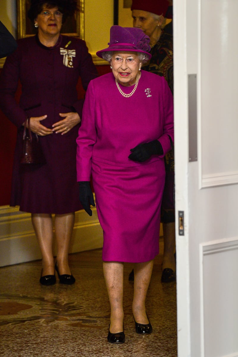 Queen Elizabeth II, wearing pink, visits The Royal Welsh Regimental Family to mark St David's Day at Lucknow Barracks in Tidworth, England, on March 3, 2017. Getty Images