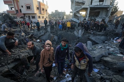 Palestinians search for bodies and survivors among the rubble following Israeli air strikes on Al Nusairat refugee camp, in the southern Gaza Strip. EPA