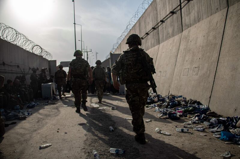 Members of the UK Armed Forces help to evacuate British nationals and vulnerable Afghans from Kabul. AFP