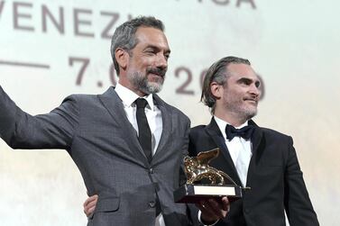 American director Todd Phillips holds the Golden Lion award for his movie ‘Joker’, posing with its star, Joaquin Phoenix, during the awarding ceremony of the 76th annual Venice International Film Festival. EPA   