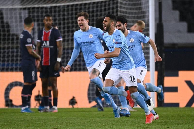 Manchester City's Algerian midfielder Riyad Mahrez celebrates after scoring a goal during the UEFA Champions League first leg semi-final football match between Paris Saint-Germain (PSG) and Manchester City at the Parc des Princes stadium in Paris on April 28, 2021. / AFP / Anne-Christine POUJOULAT
