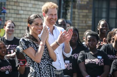 Prince Harry, Duke of Sussex and Meghan, Duchess of Sussex arrive for a visit to "Justice  desk", an NGO in the township of Nyanga in Cape Town, as they begin their tour of the region on September 23, 2019. Britain's Prince Harry and his wife Meghan arrived in South Africa on September 23, launching their first official family visit in the coastal city of Cape Town. The 10-day trip began with an education workshop in Nyanga, a township crippled by gang violence and crime that sits on the outskirts of the city. / AFP / POOL / POOL / Betram MALGAS
