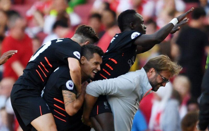 Liverpool’s Sadio Mane celebrates scoring their fourth goal with manager Jurgen Klopp, Dejan Lovren and teammates against Arsenal at the Emirates Stadium in London, Britain, 14 August 2016. Tony O’Brien / Action Images / Reuters
