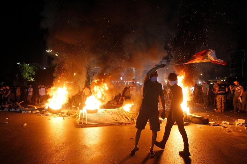 Anti-Government protestors burn tyres as they block the main highway during a protest over deteriorating living conditions after the government raised subsidized bread prices. EPA