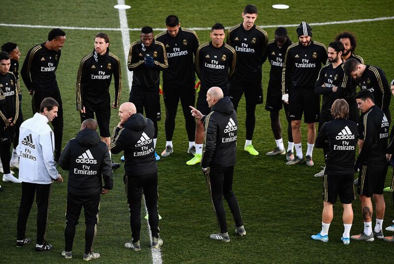 Zinedine Zidane, centre, talks to his Real Madrid squad. AFP