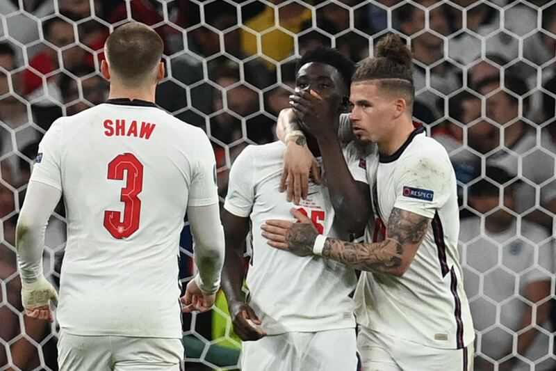 Bukayo Saka is consoled by Kalvin Phillips and Luke Shaw after missing the last penalty for England against Italy in the Euro 2020 final.