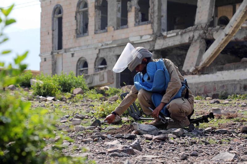 A member of the Yemeni pro-government forces searches for land mines in the third-largest city Taez in southwestern Yemen.   AFP