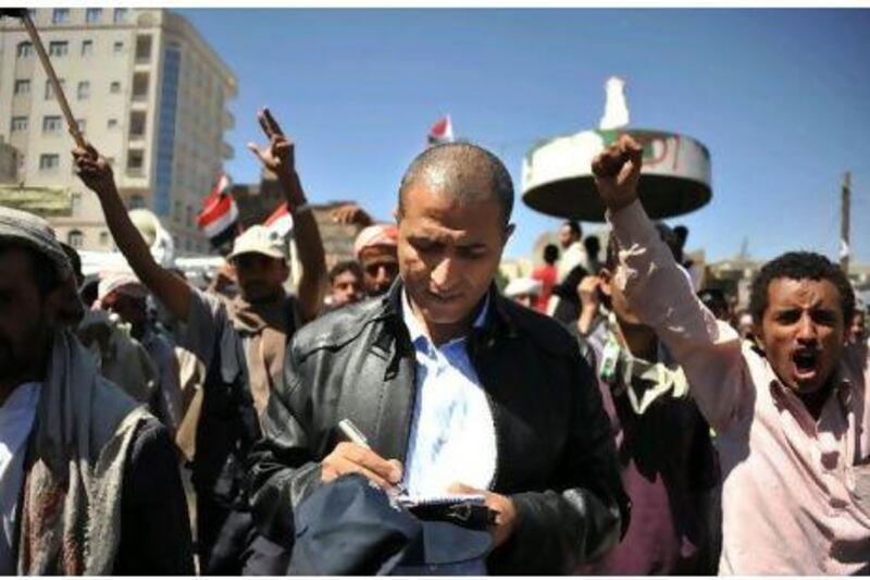 Mohammed Al Qadhi reporting on one of many street protests in Sanaa in recent months. As the situation deteriorated and street violence became widespread, his fears for his family's safety grew.