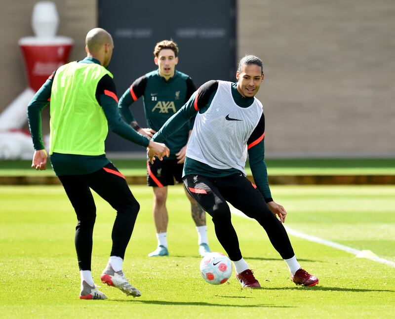 Virgil van Dijk and Fabinho take part in Liverpool's training session at AXA Training Centre in Kirkby.