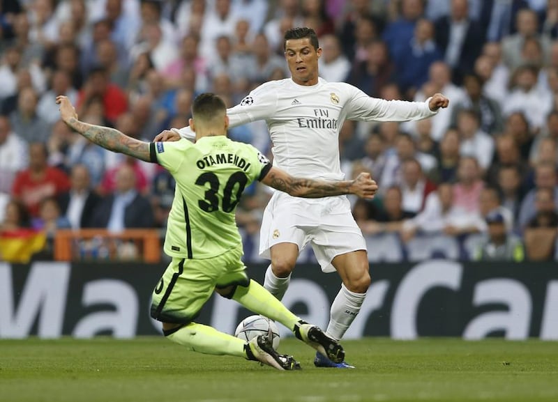 Real Madrid’s Cristiano Ronaldo in action with Manchester City’s Nicolas Otamendi. Carl Recine / Reuters
