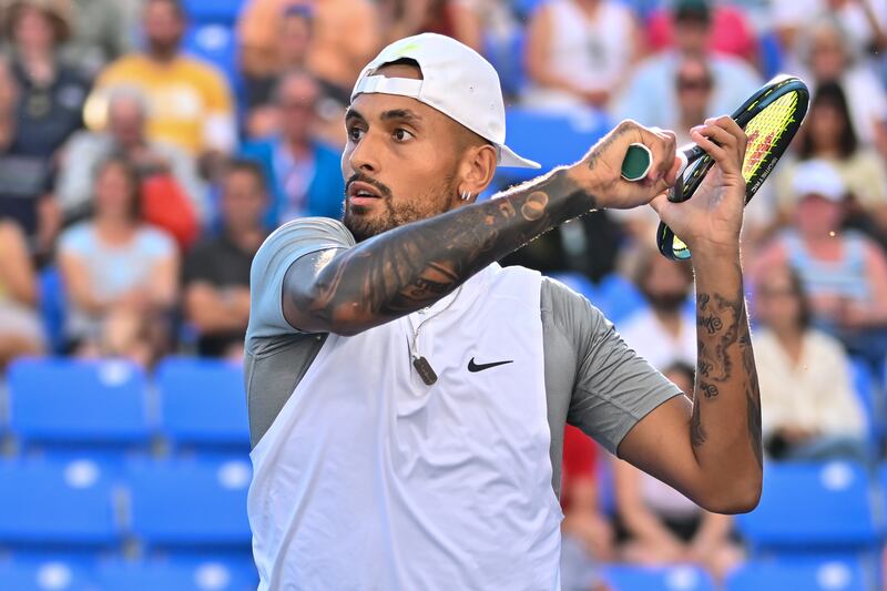 Nick Kyrgios hits a return against Alex de Minaur during Day 6 of the National Bank Open at Stade IGA on August 11, 2022 in Montreal, Canada. AFP