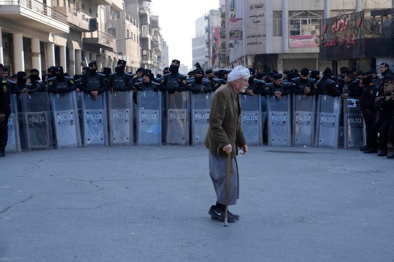 Security forces stand guard in front of the Iraqi central bank in Baghdad. AP