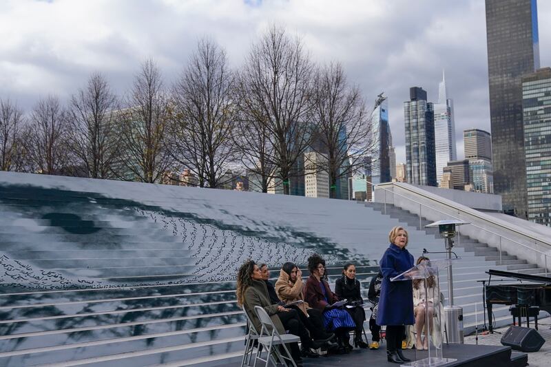 The large eye behind Ms Clinton, as well as other works of art, speaks to the current protests happening in Iran. AP