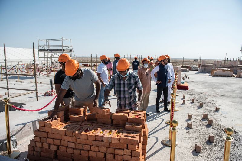 Worshippers and well-wishers are lining up to be part of the construction of the temple.