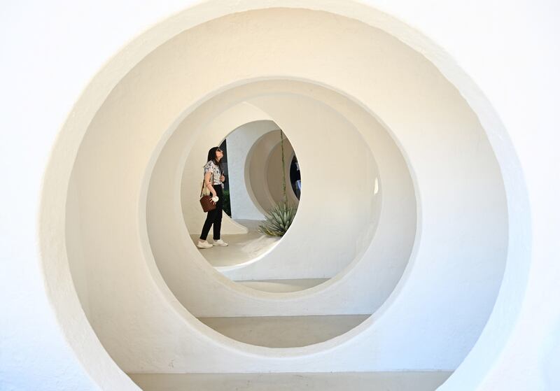 A visitor takes in the installation 'Influence' as part of Fuori Salone Milan Design Week. EPA 