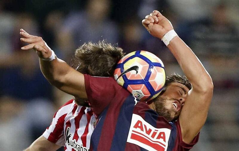 UD Eibar striker Sergi Enrich goes up for a header with Bilbao’s Yeray Alvarez at the Ipurua stadium in Eibar, Basque Country, Spain. Juan Herrero / EPA