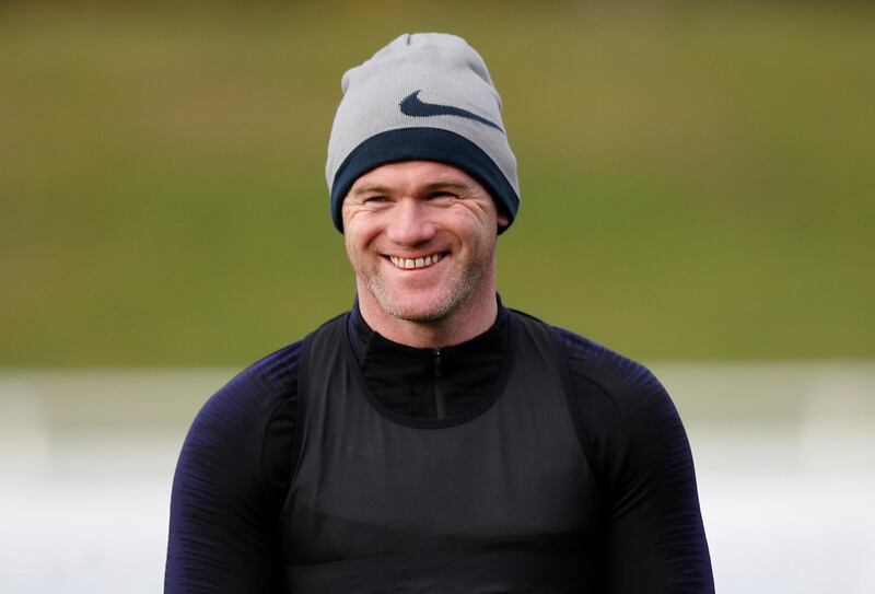 DC United striker Wayne Rooney smiles as he takes part in an England training session. Reuters