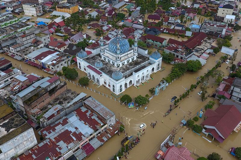 This aerial picture shows inundated buildings including a mosque during flooding in Lhoksukon, North Aceh.  AFP