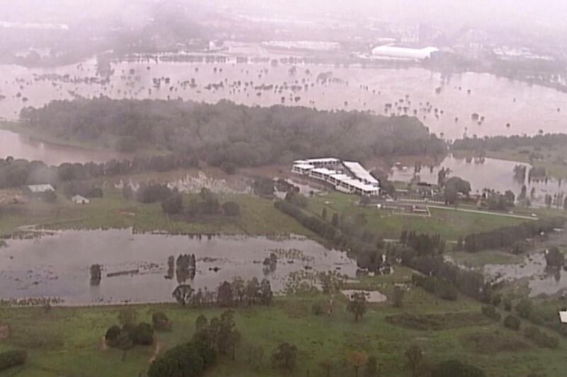 This image from a video shows flooded fields on the Gold Coast, Australia. AP