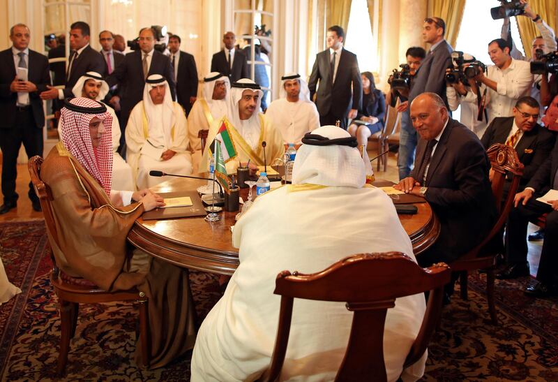 Sheikh Abdullah bin Zayed, Minister for Foreign Affairs and International Cooperation, with Saudi foreign minister Adel Al Jubeir, left, the Egyptian foreign minister Sameh Shoukry, right, and the Bahraini foreign minister Khalid bin Ahmed Al Khalifa at a meeting in Cairo on July 5, 2017, after Qatar issued its response to a list of demands from their countries. Khaled Elfiqi via AP