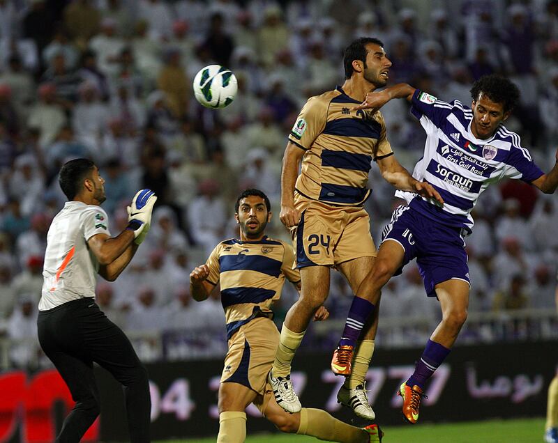 Al Ain, United Arab Emirates- April, 18,  2013: (L) Yousif Mohamamed Yousif of Dubai and (R)  Mohamed Abdulrahman of Al Ain in action  during tthe Etisalat Pro-League match  at the  Tahnon Bin Mohamed Stadium  in Al Ain .  (  Satish Kumar / The National ) For Sports