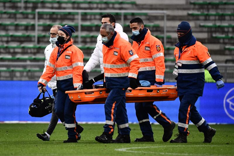 Paris Saint-Germain forward Neymar is carried off on a stretcher after injuring his ankle during the Ligue 1 match at Saint-Etienne on Sunday, November 28. AFP