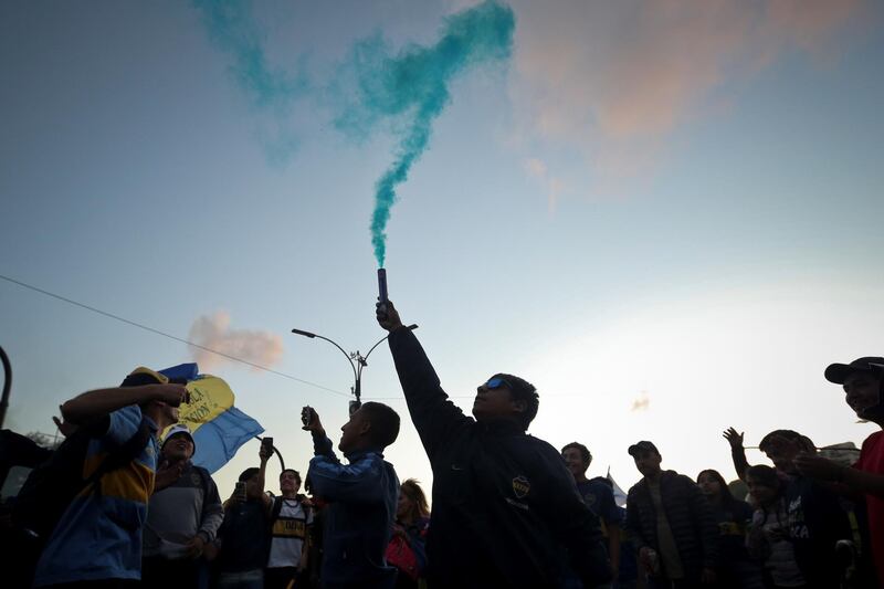 Boca fans light a flare. EPA