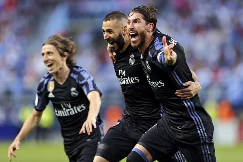 Real Madrid’s Karim Benzema, centre, celebrates scoring his side’s second goal in a 2-0 win over Malaga in Malaga, Spain, 21 May 2017. Jorge Zapata / EPA