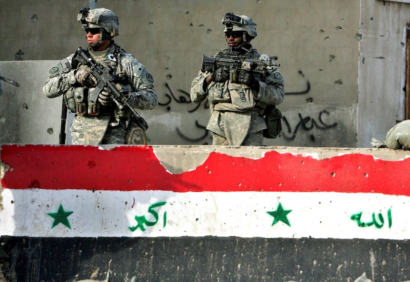 US soldiers patrol a neighbourhood in Baghdad in January 2008. AFP