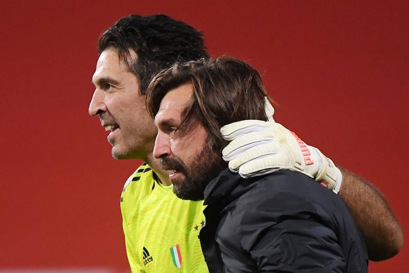 Juventus' Gianluigi Buffon with coach Andrea Pirlo celebrate after winning the Coppa Italia. Reuters